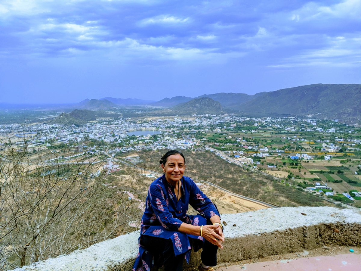 Person seated above the Pushkar landscape
