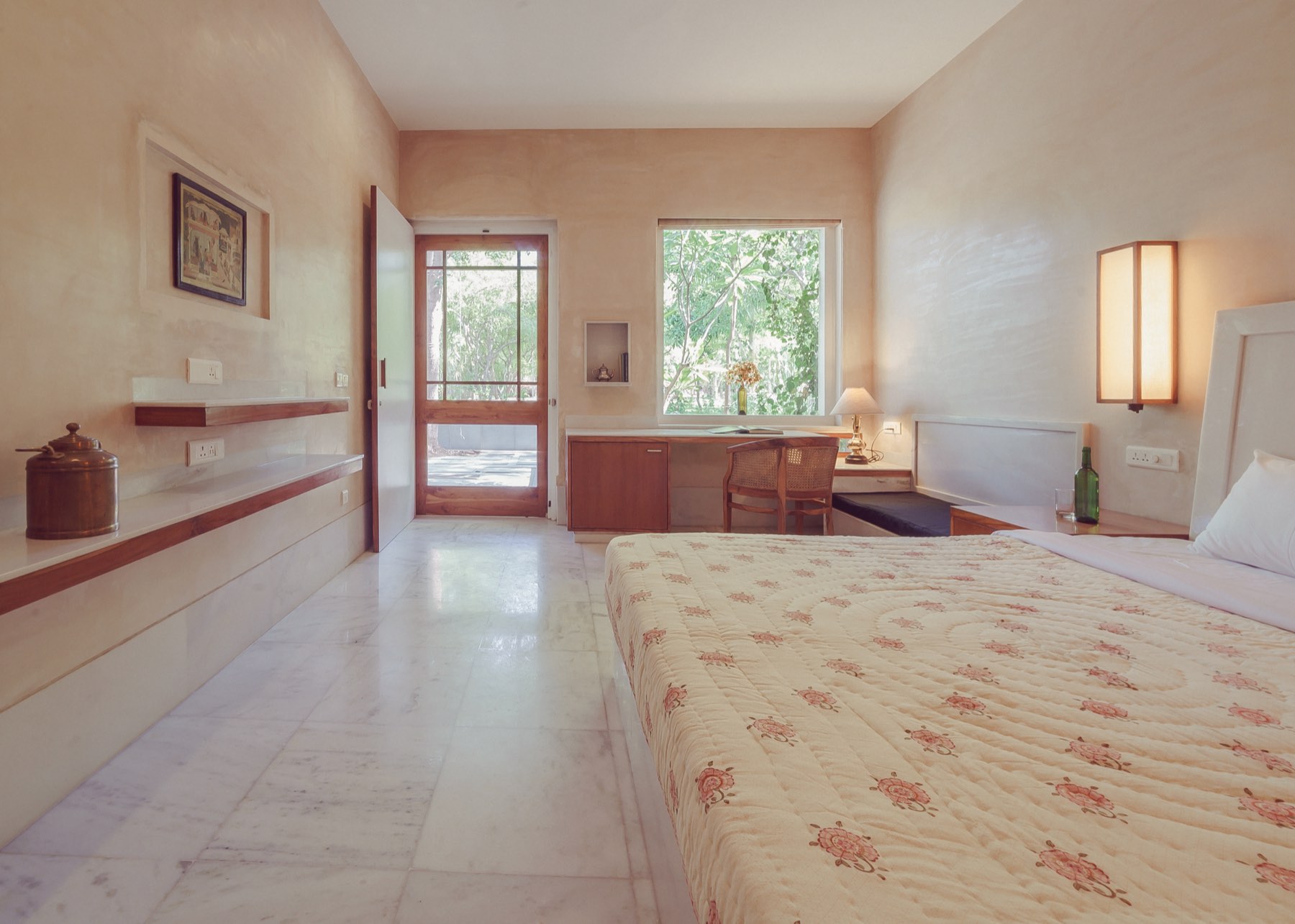 The Standard room from the door — bed, desk, and the garden window