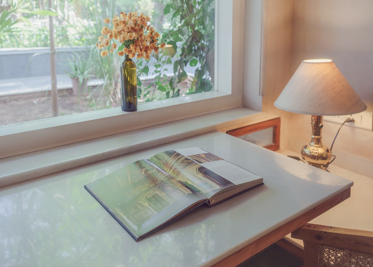 Desk with book and lamp